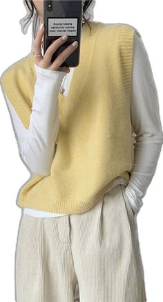 Yellow Sleeveless Vest For Fall, Casual Sleeveless V-neck Sweater For Fall, Yellow Solid Color V-neck Top, Casual Yellow V-neck Sweater, Spring V-neck Sweater Vest, Casual Yellow Sweater Vest For Fall, Sleeveless Yellow Sweater Vest For Fall, Casual V-neck Sweater Vest, Fall Casual V-neck Sweater Vest