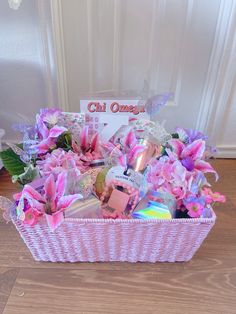 a pink basket filled with lots of different items