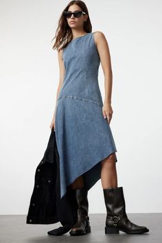 Stylish Sleeveless Blue Jean Midi Asymmetric Dress | Trendy Casual Jean Dress | Sleeveless Jean Dress | Knee-Length Denim Dress ✔️Colors may vary due to light differences in studio shootings. ✔️Wrinkles may occur during the shipping process. After receiving your clothing, you can wear it neatly like the model if you use a steam iron afterward. ✔️Model's Measurements: Height: 174 cm (5'9'') Bust: 83 cm (32 in) Waist: 60 cm (23 in) Hips: 89 cm (35 in) The model is wearing a size S/36/8. Material C Casual Asymmetrical Denim Dress, Casual Denim Dress With Asymmetrical Hem For Summer, Casual Summer Denim Dress With Asymmetrical Hem, Chic Washed Blue Sleeveless Dress, Blue Denim Dress With Asymmetrical Hem, Blue Sleeveless Asymmetrical Dress For Spring, Summer Denim Dress With Asymmetrical Hem, Casual Blue Asymmetrical Dress, Fitted Asymmetrical Denim Dress