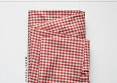 a red and white checkered cloth folded up