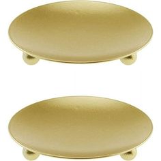 two gold plates sitting next to each other on a white background, one is round and the other is oval