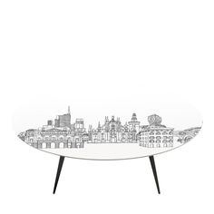 a white table with black legs and an image of buildings on the top of it