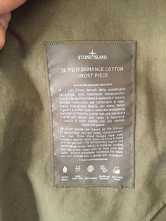 a label on the back of a jacket that says 3l performance cotton ghost piece