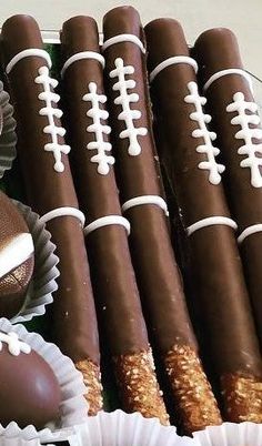 a football themed cake with chocolates and pretzels