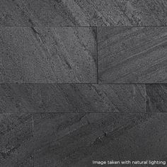 an image taken with natural lighting in black and grey tones, showing the texture of stone