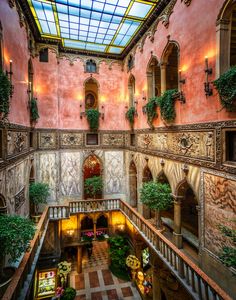 an indoor courtyard with potted plants and windows