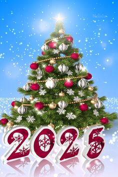 a christmas tree with the numbers 2013 and ornaments on it in front of snowflakes