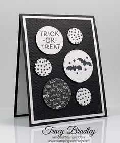 a black and white card with buttons on the front, saying trick - or - treat