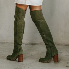 Our best-selling thigh-high boot will elevate any ensemble. The Logan olive over-the-knee boot features a soft, unlined suede upper, an easy to wear heel height, and an elastic back panel at the calf for added comfort. Suede upper in olive Insole: Canvas Lining material: Vamp, canvas and shaft unlined Outsole: Recycled rubber Style type: Over the knee boot Heel material: Stacked Heel height: 3.15 inches Shaft height: 20 inches Calf circumference: 14 inches Brass functional inside zipper Elastic Brown Suede Boots Outfit, Green Thigh High Boots, Suede Boots Outfit, Womens Fall Boots, Work Fits, Knee Boot, Wide Calf Boots, Recycled Rubber, Tres Chic