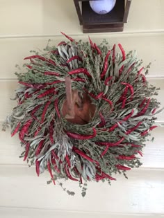 a wreath hanging on the side of a house