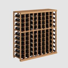 a wooden wine rack filled with lots of bottles