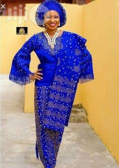 This beautiful dress is handmade with quality African aso oke/lace * It is fully lined *it is designed with stones * It is suitable for any occasion. It takes 5-7 business days to produce and 3-5 business days to deliver. Shipping is done through DHL express. Sizing: Kindly check our size chart to guide you in selecting a size that fits you best. You can also send the following measurements in order to ensure a perfect fit: Shoulder to shoulder Shoulder to waist Shoulder to hem(dress length) Bus Elegant Evening Sets With Lace Work, Elegant Blue Agbada For Traditional Ceremonies, Elegant Embellished Sets For Traditional Ceremonies, Elegant Blue Agbada For Wedding, Elegant Blue Agbada For Festive Occasions, Traditional Lace Sets For Formal Occasions, Elegant Wedding Gown With Traditional Patterns, Elegant Floor-length Formal Traditional Wear, Elegant Traditional Wear With Lace Work For Party