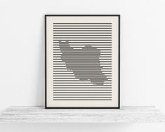 a black and white poster with lines in the shape of a heart on top of a shelf