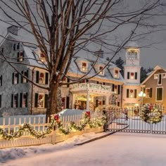 a large house with christmas lights on it's windows