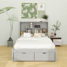 a bed with two storage drawers underneath it