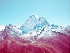 the mountains are covered in red and white snow