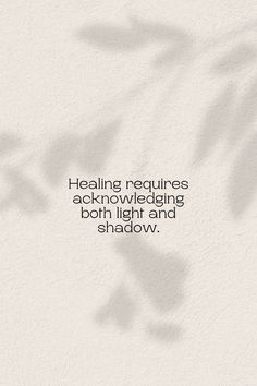 the shadow of a plant on a wall that says, healing requires acknowwedding both light and shadow