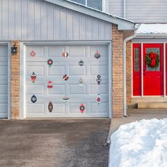 a garage door with christmas decorations on it