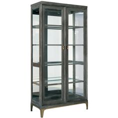 a tall glass display case with two doors