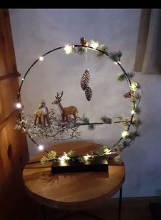 a christmas decoration with deer and pine cones