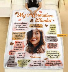 a woman sitting on top of a couch under a blanket that says my affirmations blanket