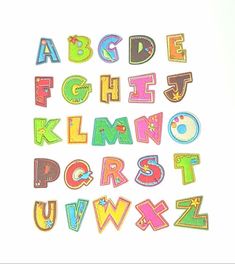 the letters and numbers are made out of colored felts on a white surface,