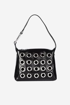 This version of the signature Slim Moon bag has been crafted in Italy from patent leather, it also features a cut-out front detail with metal eyelet. The top handle is accented with a snap hook that features a functioning hinge. Composition:100% Calf Leather & Metal Patches Made in Italy Colour: Black Hook:100% Eco Brass Hook SIZE & FIT Bag Dimensions: 18x15x6 cm EÉRA'S NOTE This bag turns out to be highly versatile and can match any type of outfit, from day to night. Egirl Bag, Metal Patches, Moon Bag, Black Hook, Brass Hook, Ring Bracelet, Jewelry Care, Top Handle, Calf Leather