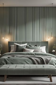 a large bed sitting next to a wall with lights on it's headboard