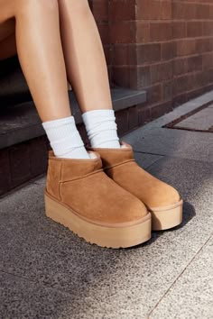 This is one of our most precious styles, and boy, do we have the viral-status receipts to prove it. This ultra, elevated Classic boot is a must-have combination of newness and nostalgia. It's made with rich suede and lined inside with our UGGplush™ wool blend for signature softness. The outsole of this product is either a sugarcane EVA outsole, which is a responsible compound using sugarcane foam that allows us to reduce dependency on fossil fuels by replacing petroleum-based ethylene, or a Trea Ugg Micro Mini Platform, Ugg Platform Ultra Mini, Ugg Ultra Mini Platform, Ugg Mini Boots, Winter Uggs, Shoes Wishlist, Cute Uggs, New Uggs, Ugg Ultra Mini