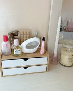 an assortment of personal care items on a dresser