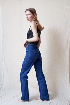 "High waist bootcut jeans in a dark blue wash. These jeans are a staple piece for any wardrobe, and look great with everything from blouses to sweaters. They feature a high waist, belt loops, front and back pockets and zipper fly.  In excellent condition.  The model is 5'7 and size 8 (UK). MEASUREMENTS Waist: 73.5 cm / 29\" Hips: 94 cm / 37\"  Thigh: 51 cm / 20\"  Rise: 29 cm / 11.5\" Inseam: 76 cm / 30\"  Length: 103 cm / 40.5\" MATERIAL: 100% Cotton FREE UK SHIPPING on orders over £100 - use the code LUCKYUK at checkout." Vintage High Waisted Jeans, Blue Bootcut Jeans, High Waisted Jeans Vintage, Dark Blue Jeans, Jeans Bootcut, High Waisted Jeans, Staple Pieces, High Rise Jeans, Vintage Denim