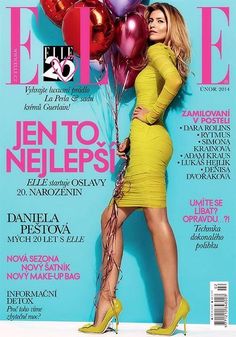 a woman in a yellow dress holding balloons on the cover of a magazine, with her legs crossed