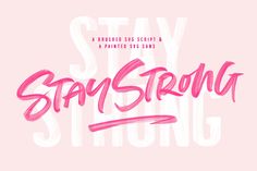 the words stay strong are painted in pink and white on a light pink background with an artistic