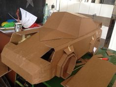 a cardboard car is sitting on the table