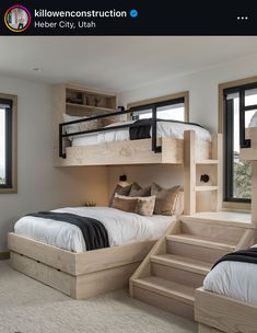 a bedroom with bunk beds and stairs leading to the upper bed area, which also has two windows