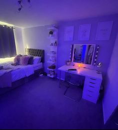 a bedroom with purple lighting in the corner and a bed, desk, mirror and dresser