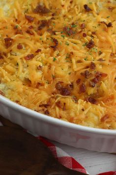 a casserole dish with cheese and bacon in it