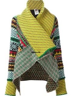 a woman's yellow and green sweater with multicolored patterns on it,