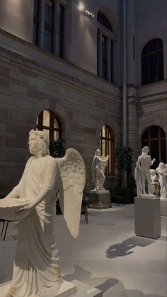 an angel statue in the middle of a building