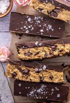 chocolate and peanut butter bars on a wooden table