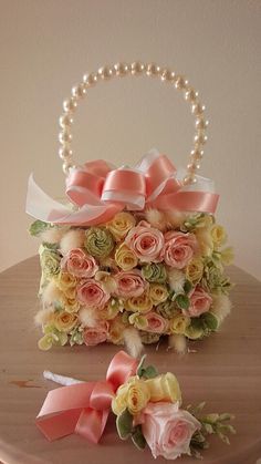 a basket with flowers and pearls on it