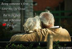 an older couple sitting on a bench with their backs to each other, looking at birds