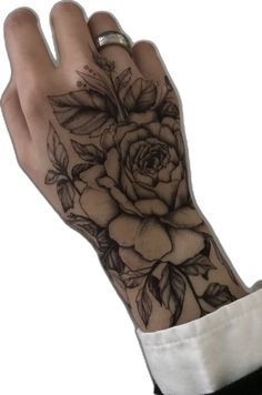 a woman's hand with a rose tattoo on it