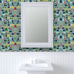 a bathroom sink sitting under a mirror in front of a wall mounted medicine cabinet next to a white sink