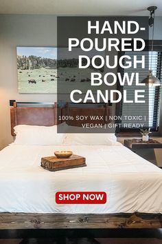 a bed sitting in a bedroom next to a window with the words hand - poured dough bowl candle on it