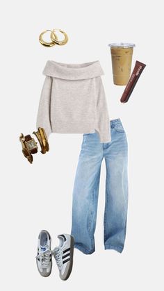 a white sweater, jeans and shoes are arranged in the shape of a woman's outfit