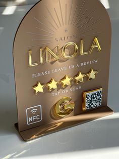 a plaque with five stars on it that says limoola please leave us a review tap or scan