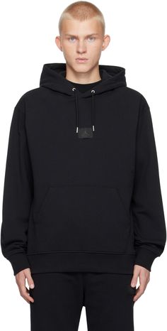 French terry hoodie. · Drawstring at hood · Logo patch at front · Kangaroo pocket · Rib-knit hem and cuffs · Dropped shoulders Please note that this item may be shipped only within North America. Supplier color: Black Nike Jordan Black, Black Jordans, Jordan Black, French Terry Hoodie, Mens Activewear, Nike Jordan, Fleece Hoodie, Black Hoodie, Kangaroo Pocket