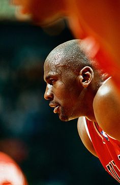 a close up of a basketball player with the ball in his hand