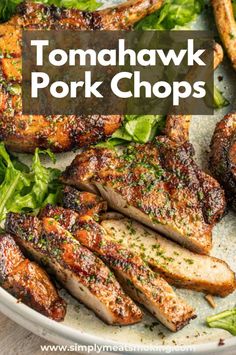 pork chops on a plate with lettuce and tomatoes